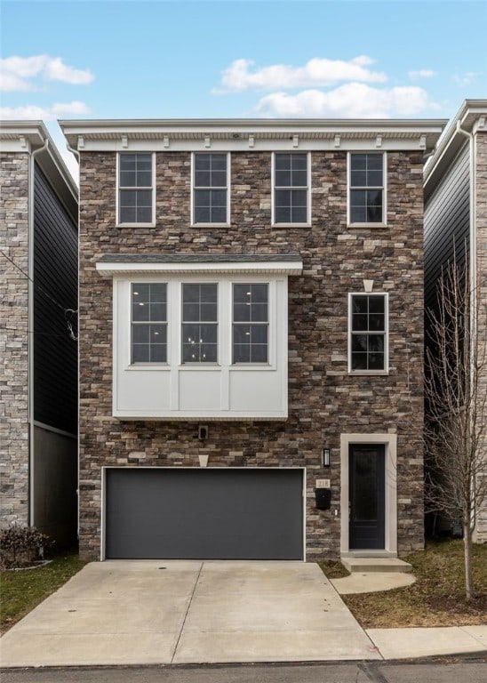 view of front facade featuring a garage and concrete driveway