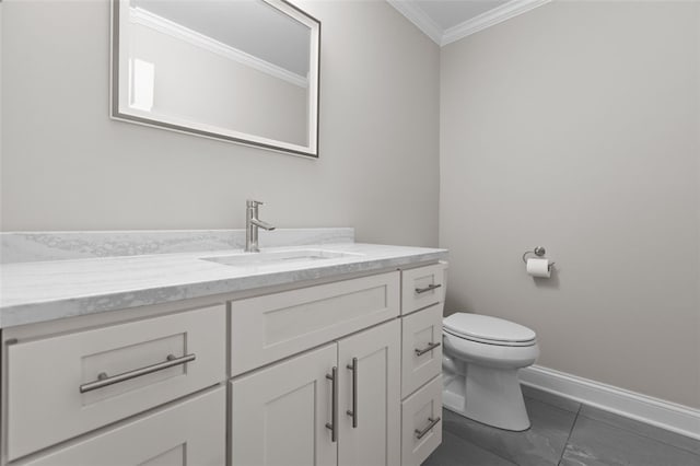 half bathroom with ornamental molding, baseboards, vanity, and toilet