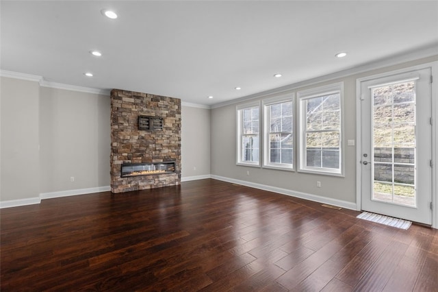 unfurnished living room featuring baseboards, wood finished floors, crown molding, a fireplace, and recessed lighting