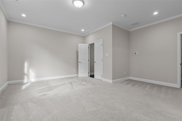 interior space with recessed lighting, baseboards, ornamental molding, and light colored carpet