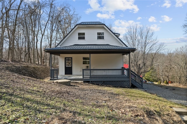 view of front of house featuring a porch and metal roof