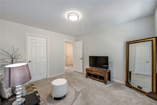 living room with light carpet and baseboards