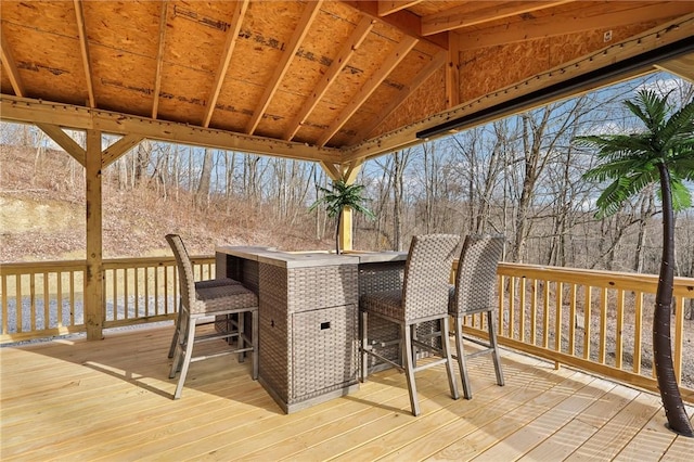 wooden deck featuring outdoor dry bar