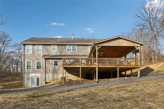 rear view of property with a deck