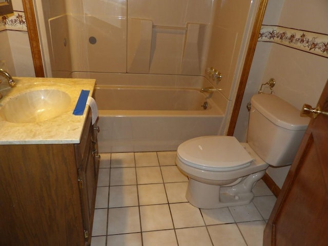 bathroom featuring shower / bathtub combination, vanity, tile patterned flooring, and toilet