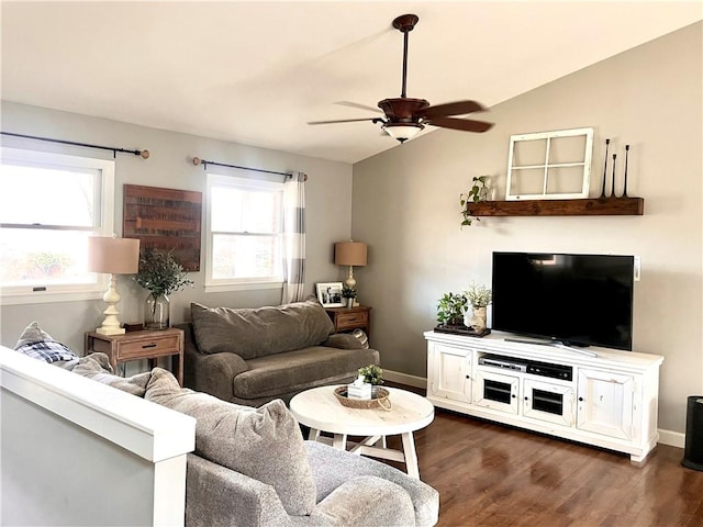 living room with dark wood-type flooring, vaulted ceiling, baseboards, and a ceiling fan