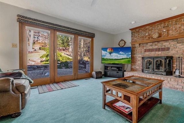 living area featuring carpet floors and a fireplace