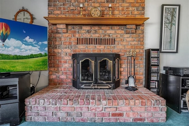 interior details with carpet flooring and a fireplace