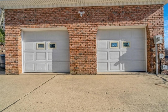 garage featuring driveway