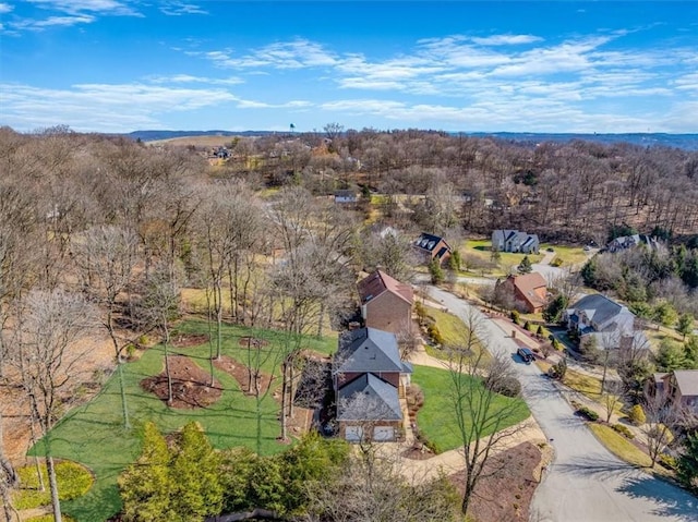 aerial view featuring a view of trees