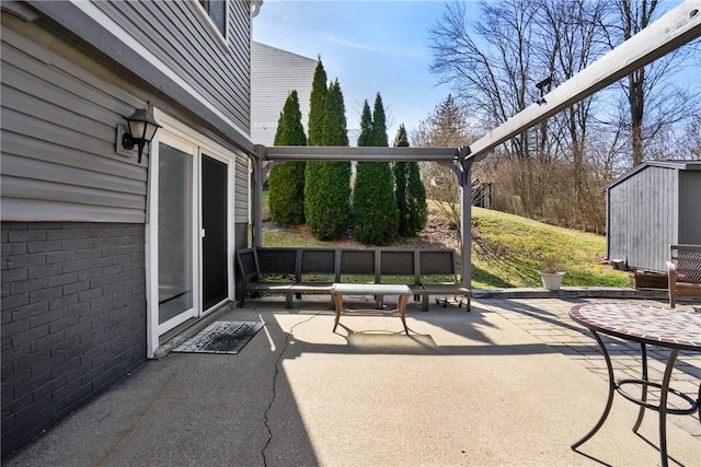 view of patio featuring an outdoor structure