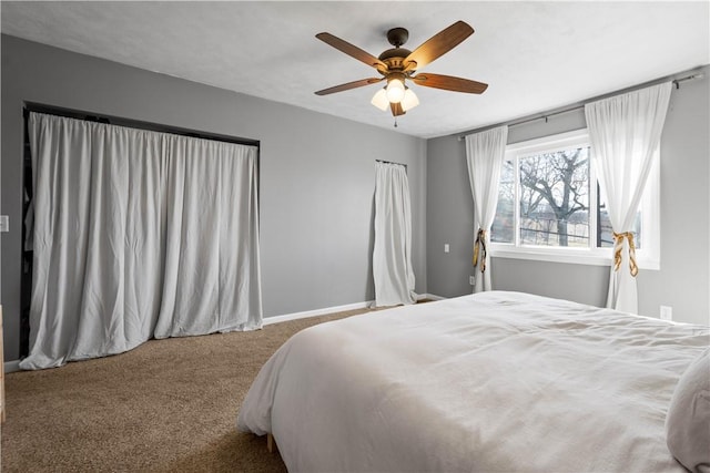 bedroom featuring ceiling fan, baseboards, and carpet flooring