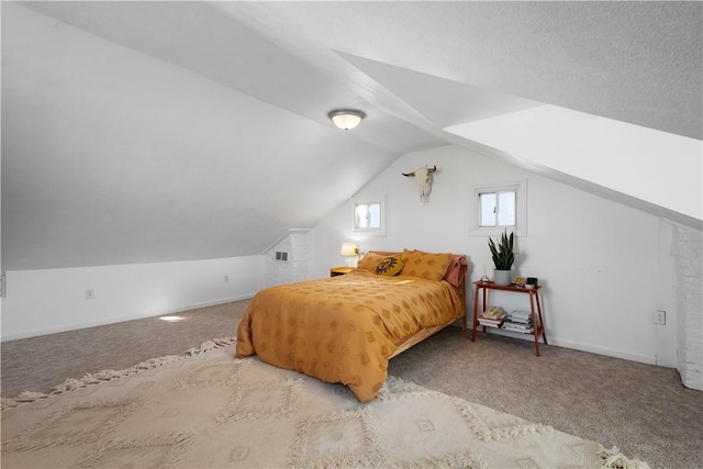 bedroom featuring carpet floors, lofted ceiling, visible vents, and baseboards