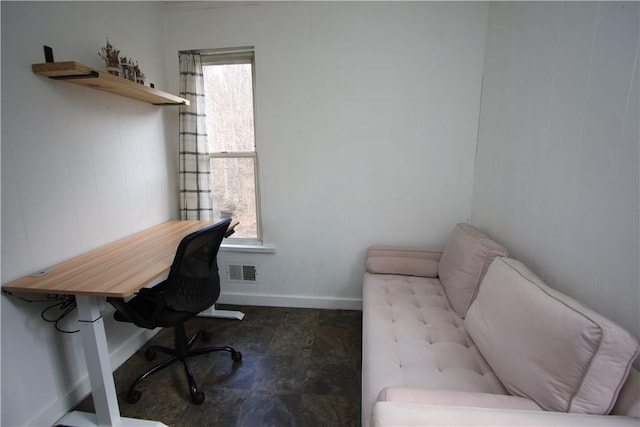 office area with visible vents and baseboards