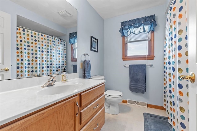 bathroom featuring toilet, baseboards, visible vents, and vanity