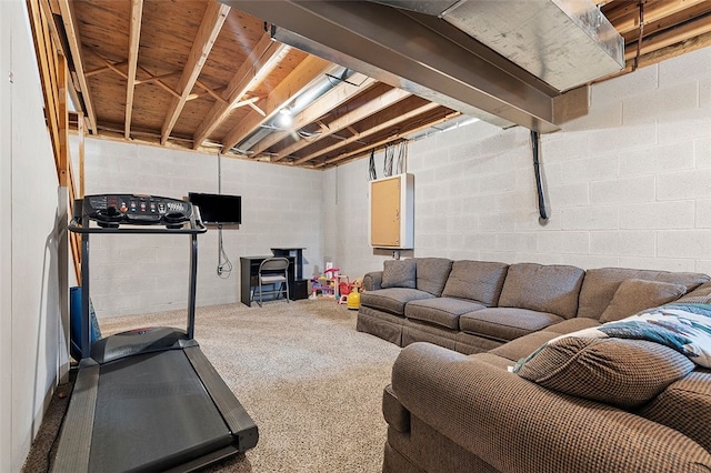 workout room featuring concrete block wall