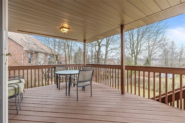 wooden deck with outdoor dining space