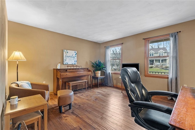 office space with baseboards and hardwood / wood-style floors