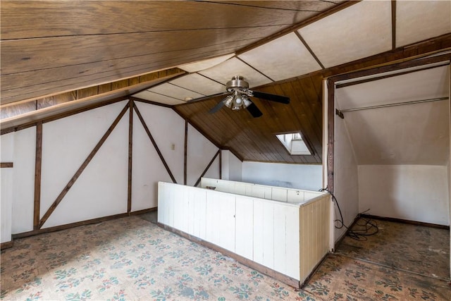 bonus room with vaulted ceiling with skylight and ceiling fan