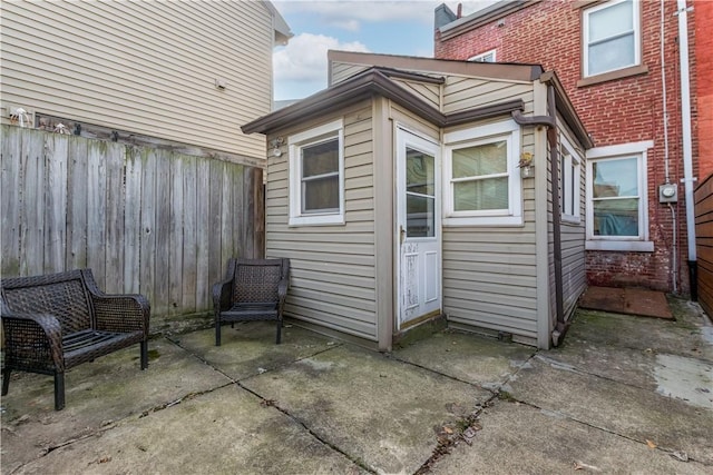 view of outbuilding featuring fence