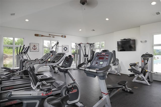 exercise room featuring baseboards, visible vents, and recessed lighting