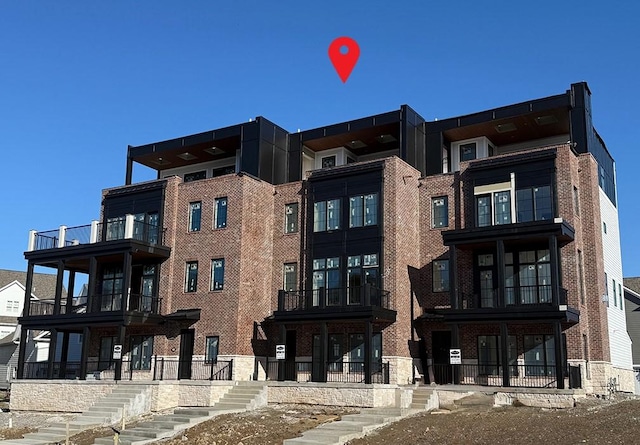 view of property with stairway
