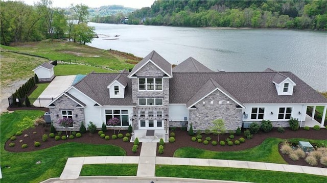 birds eye view of property featuring a water view