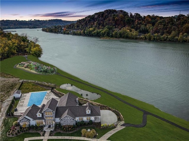 birds eye view of property with a water view