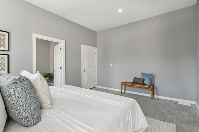 carpeted bedroom featuring baseboards