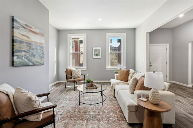 living area with recessed lighting, wood finished floors, and baseboards