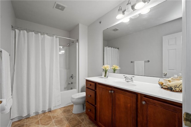 bathroom with visible vents, toilet, shower / bath combo, vanity, and tile patterned flooring