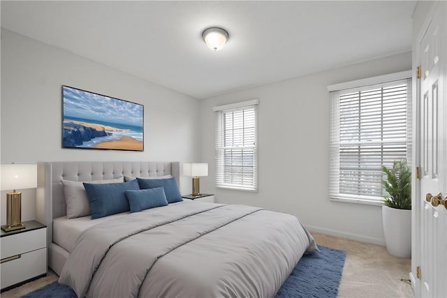 carpeted bedroom with baseboards