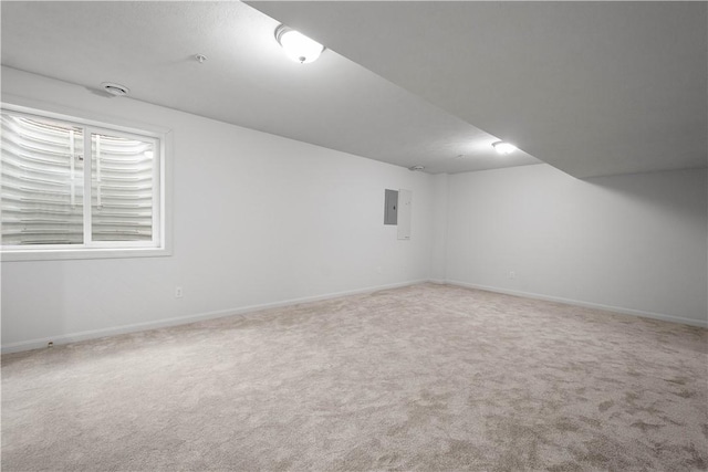 carpeted spare room with baseboards