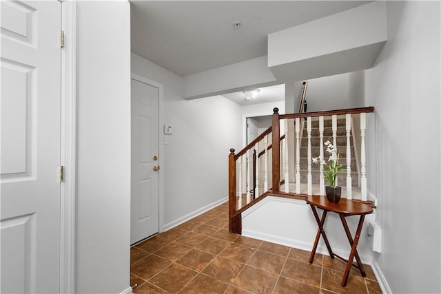 interior space with tile patterned flooring and baseboards