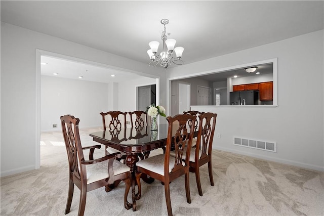 dining room featuring a notable chandelier, recessed lighting, light colored carpet, visible vents, and baseboards