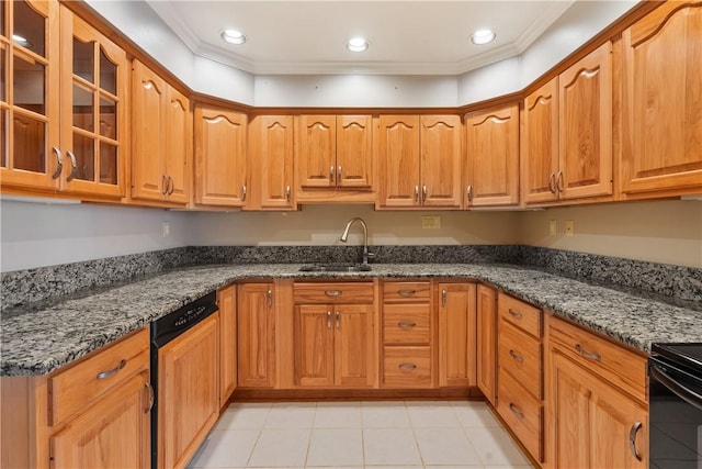 kitchen with ornamental molding, a sink, dark stone countertops, recessed lighting, and glass insert cabinets