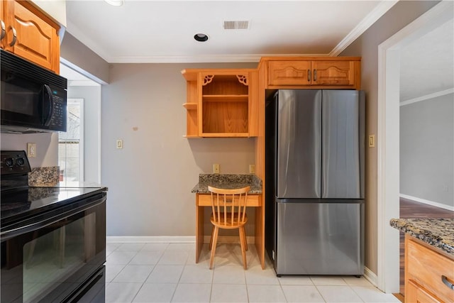 kitchen with baseboards, visible vents, dark stone counters, black appliances, and crown molding