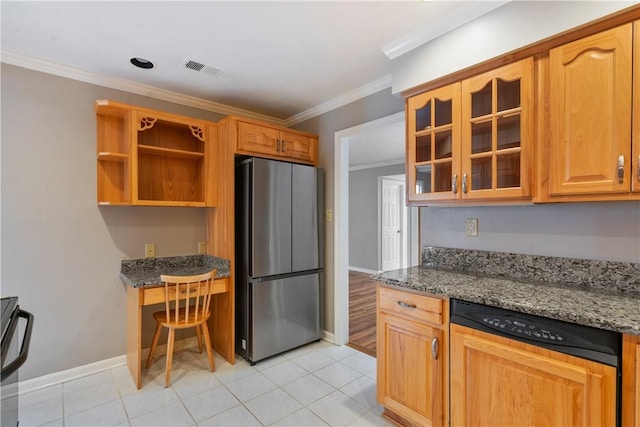 kitchen with crown molding, glass insert cabinets, stone counters, freestanding refrigerator, and light tile patterned flooring