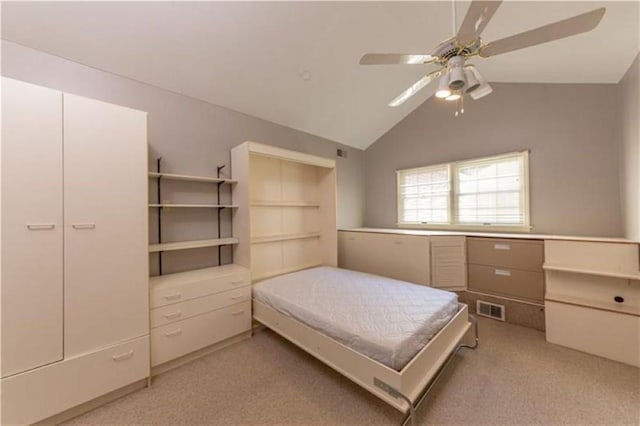 bedroom featuring light colored carpet, lofted ceiling, a ceiling fan, and visible vents