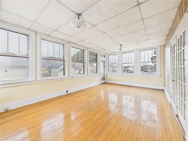 unfurnished sunroom with a paneled ceiling
