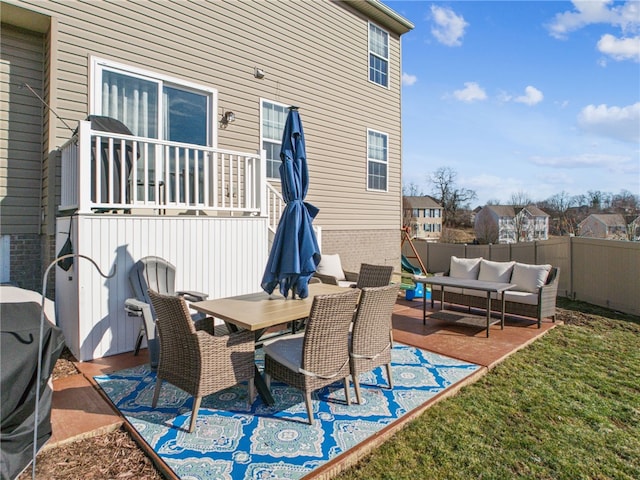 view of patio featuring an outdoor hangout area, outdoor dining area, and fence