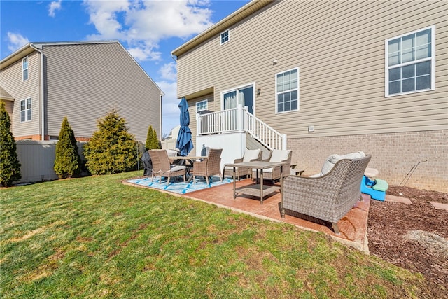 back of house featuring a yard, a patio area, and fence