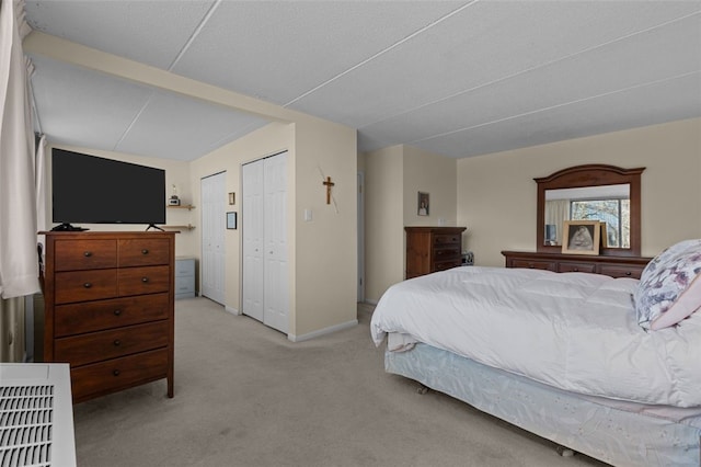 carpeted bedroom featuring baseboards