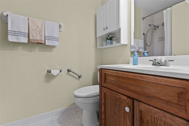 full bathroom with baseboards, toilet, curtained shower, tile patterned flooring, and vanity