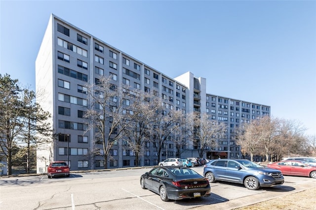 view of property with uncovered parking