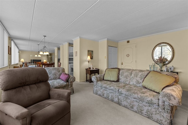 carpeted living area with baseboards and a textured ceiling