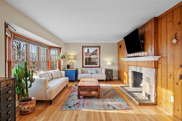 living room with plenty of natural light and wood finished floors