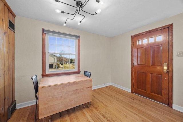 entrance foyer with light wood-type flooring, visible vents, and baseboards