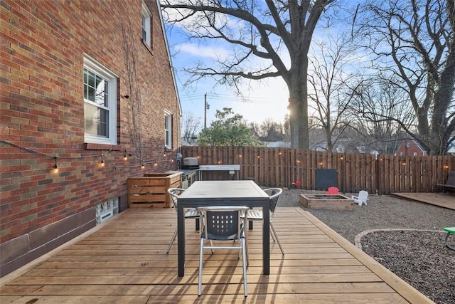 deck featuring fence and outdoor dining space