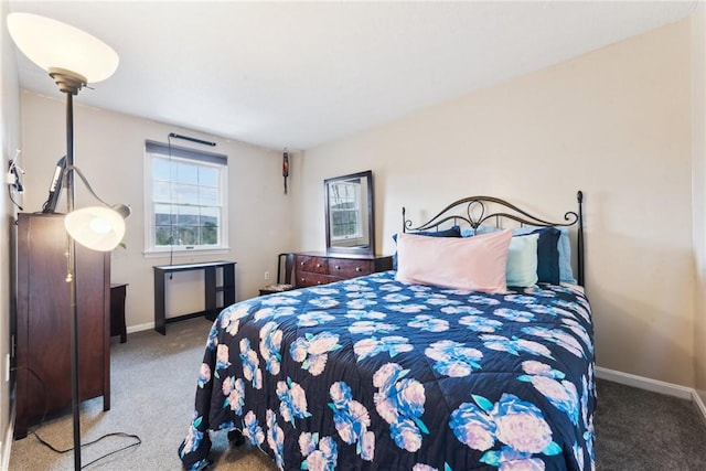 carpeted bedroom featuring baseboards